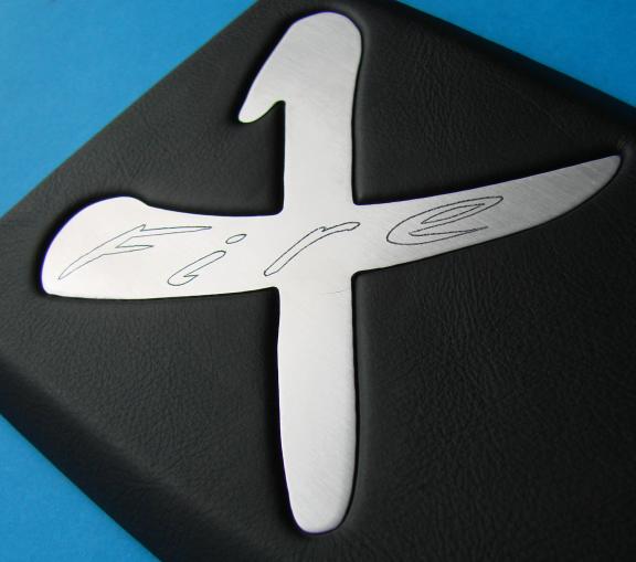 Armrest with engraved aluminum trim