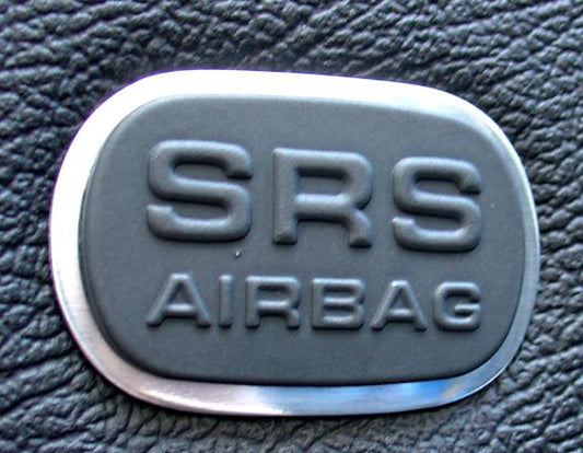 2 Zierrahmen Airbagschilder in den Türen