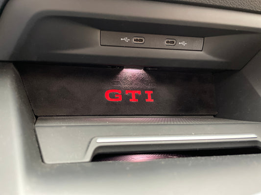 03e. Phone compartment trim with GTI logo, Alcantara look