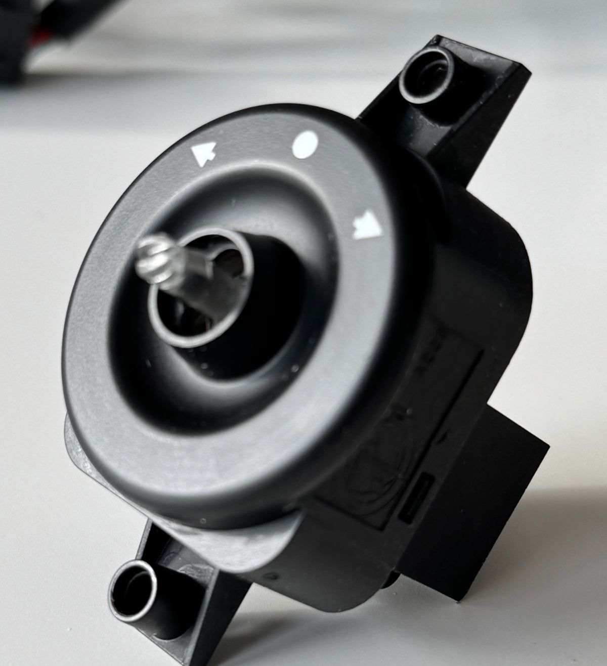 Soft-touch paint restoration for mirror adjustment switch
