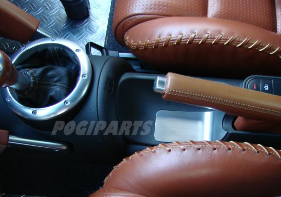 Trim panel below the handbrake
