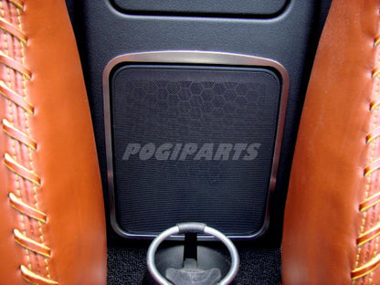 2 decorative trim pieces for storage compartment and speaker