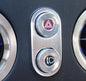 Bezel around hazard warning/folding headlight switch