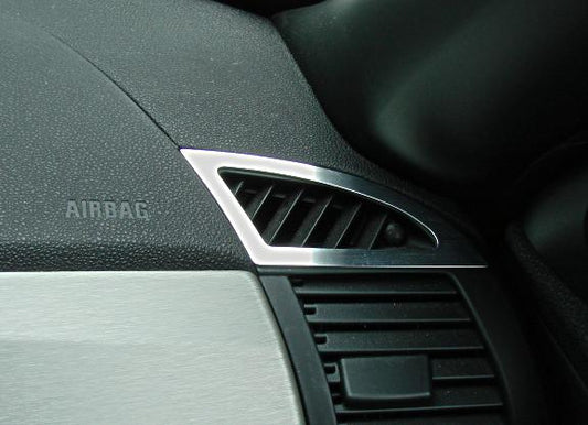 2 decorative trim pieces for side defroster nozzles