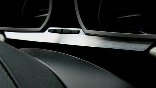 1 decorative trim piece below the speedometer