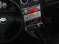 Bezel above/below radio lettering for DIN slot without CLOCK