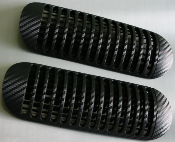 Carbon-look coating for center air vents