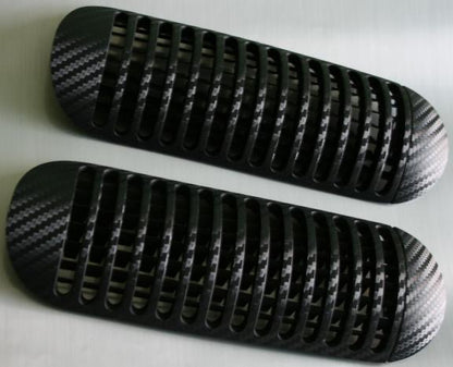 Carbon-look coating for center air vents