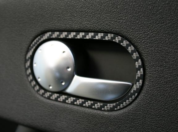 Carbon-look coating for the door openers