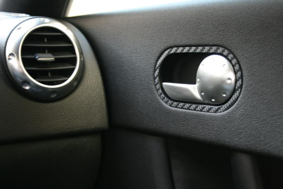 Carbon-look coating for the door openers