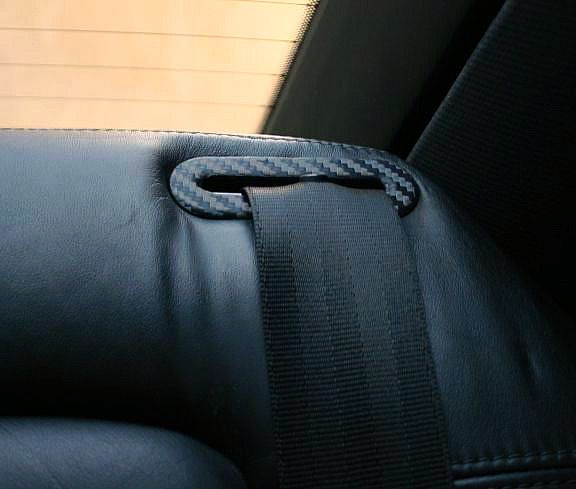 Carbon trim rear seat belt