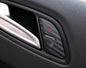 Carbon-look coating for door lock buttons