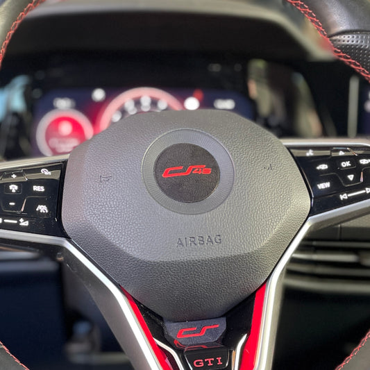 05h. Steering wheel logo cover with CS45 logo
